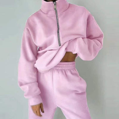 Rosa Damen-Trainingsanzug mit Reißverschluss, weiches Material, modische Freizeitkleidung.