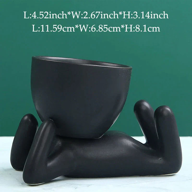 Schwarzer Keramik-Blumentopf in Form einer liegenden Figur, modern, dekorativ, 11,59 cm.