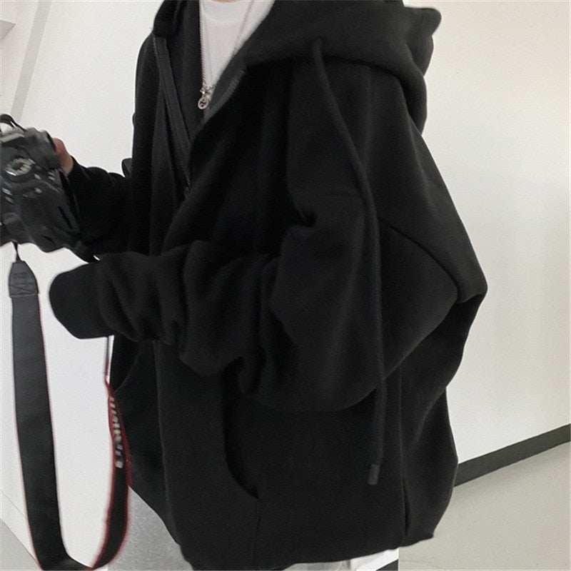 Schwarzer Unisex Hoodie, Baumwolle, lässig, mit Kapuze, ideal für Herbstmode, Streetwear.