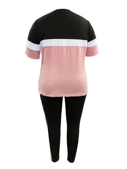 Damen Sportanzug, schwarz-rosa, kurzärmelig, zweiteilig, bequem, Freizeitkleidung.