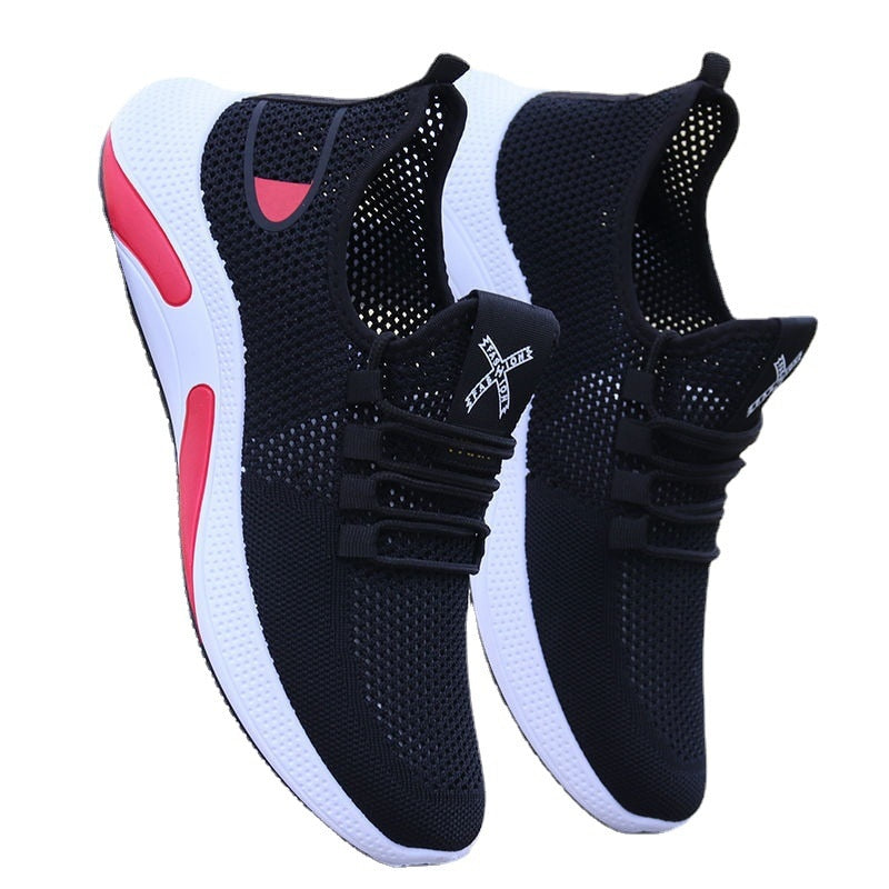 Schwarze Sportschuhe mit weißer Sohle und rotem Akzent, atmungsaktives Mesh, Herren Sneaker.