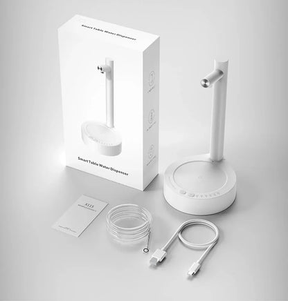 Weißer SmartTable Wasserspender, USB-Kabel, Schlauch, Verpackung, modernes Design.