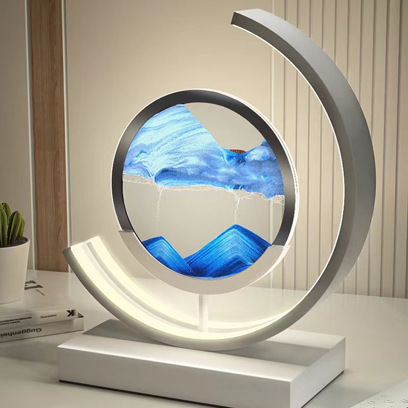Moderne Sanduhrlampe mit blauem Sandbild, LED-Beleuchtung, dekorative Tischleuchte, weiß.