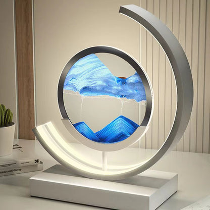 Moderne Sanduhrlampe mit blauem Sandbild, LED-Beleuchtung, dekorative Tischleuchte, weiß.