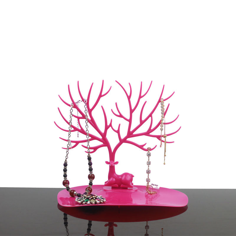 Rosa Hirsch Schmuckständer aus Kunststoff, ideal zur Schmuckaufbewahrung und Dekoration.