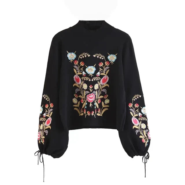 Schwarzer Damenpullover mit floraler Stickerei, Vintage-Stil, langärmelig, Rollkragen.