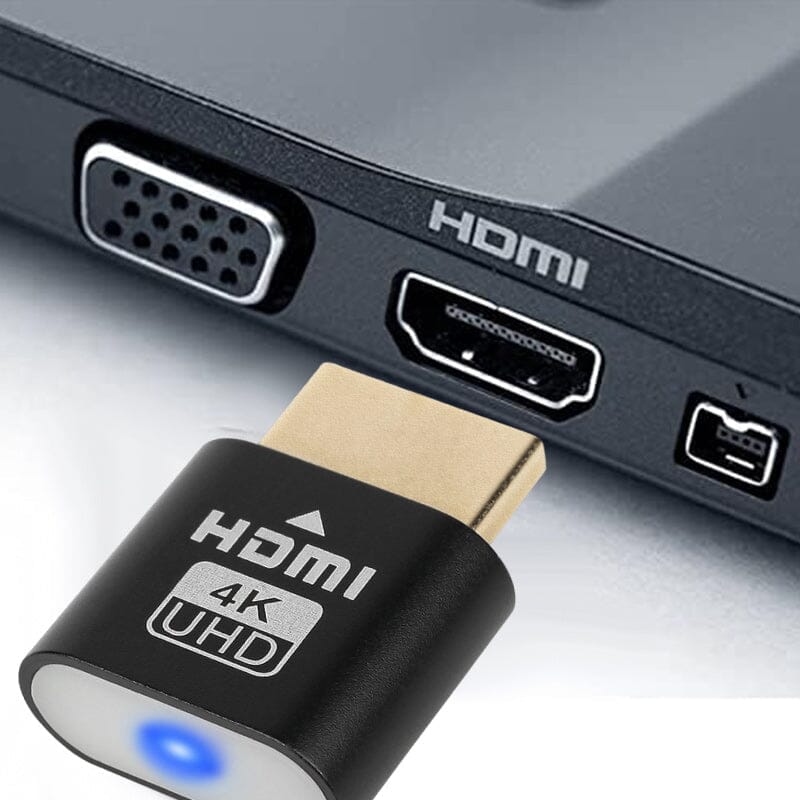 Svart HDMI-enhet på väg att sättas in i en HDMI-port på sidan av en bärbar dator. 3