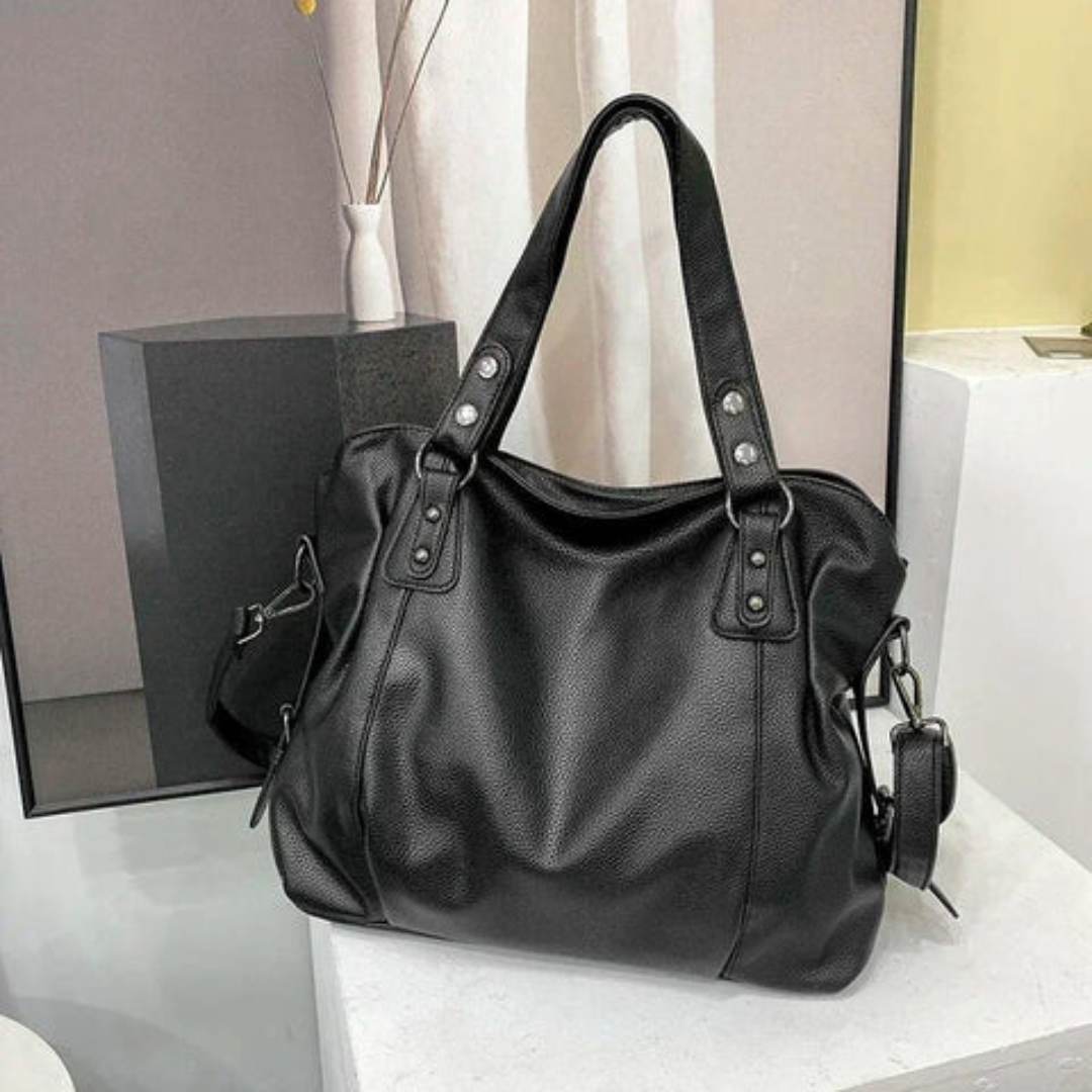 Schwarze Lederhandtasche, Damen, elegant, geräumig, mit Trageriemen, modisch, hochwertig.