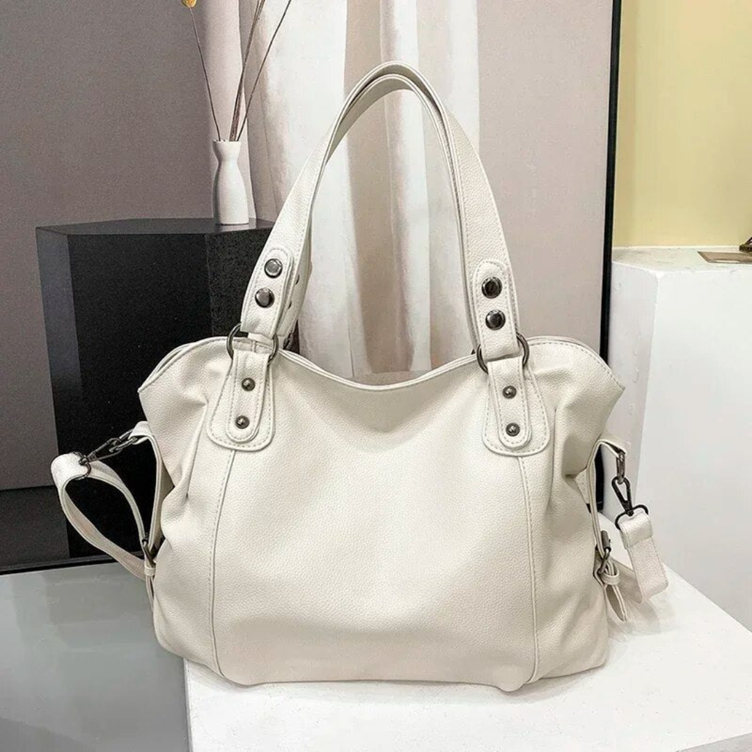 Weiße Lederhandtasche mit Schulterriemen, elegantes Design, Damenmode Accessoire.