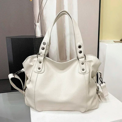 Weiße Lederhandtasche mit Schulterriemen, elegantes Design, Damenmode Accessoire.
