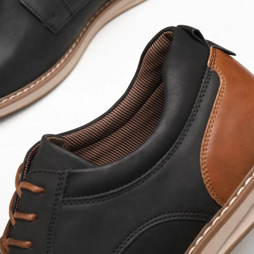 Schwarze und braune Herrenschuhe aus Leder, elegante Freizeitschuhe, Nahaufnahme.