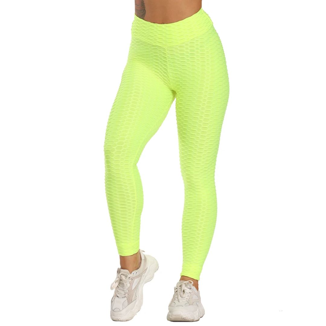 Neon-gelbe Damen-Leggings, strukturierte Textur, sportlich, elastisch, ideal für Fitness.