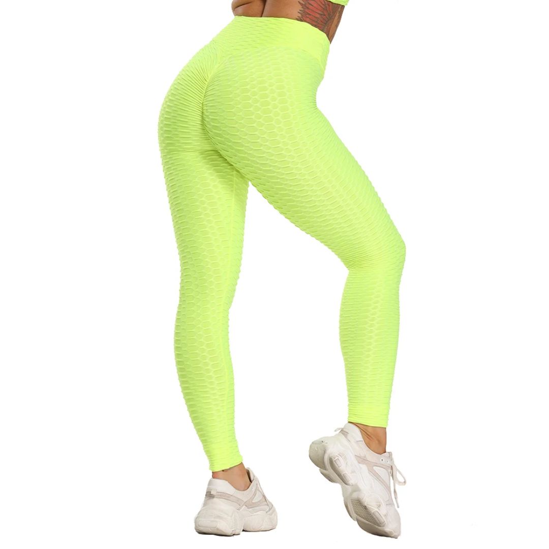 Neon-gelbe Damen-Leggings, hoch tailliert, strukturierter Stoff, ideal für Fitness und Sport.