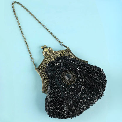 Vintage schwarze Perlenhandtasche mit Metallkette, elegantes Design, Abendmode Accessoire.