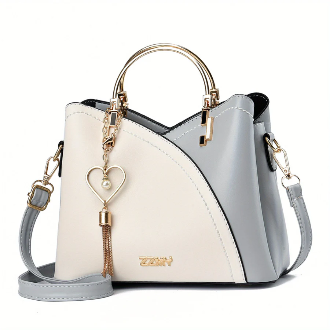Damenhandtasche zweifarbig, beige und grau, mit Herzanhänger, elegantes Design, Lederoptik.