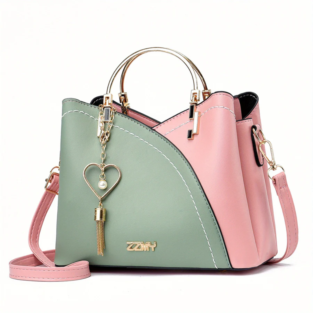Damenhandtasche rosa-grün, Leder, goldener Henkel, Herzanhänger, modisch, elegant.