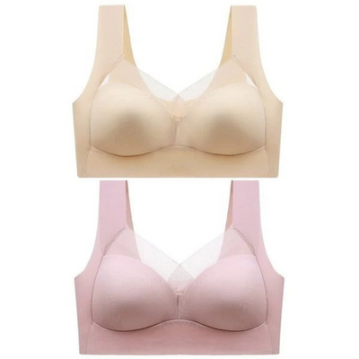 Två sömlösa bhar på vit bakgrund, en beige ovanpå en rosa, båda med mesh i urringningen. 20
