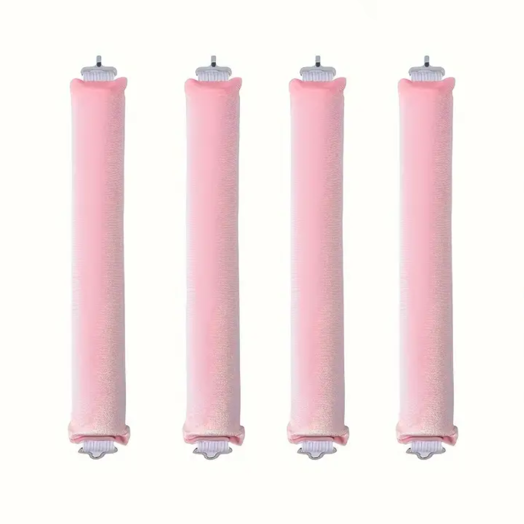 Vier rosa Wasserfilterkartuschen, zylindrisch, für Trinkwasseraufbereitung, umweltfreundlich.