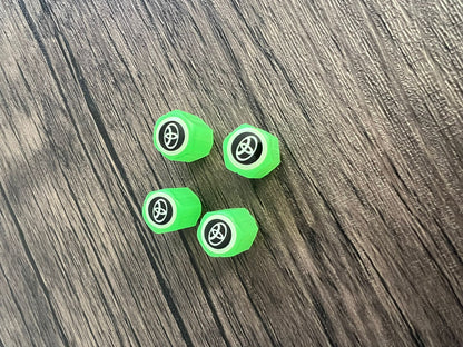 Set med 4 lysande ventilkåpor med logotyp – LuxaGlow
