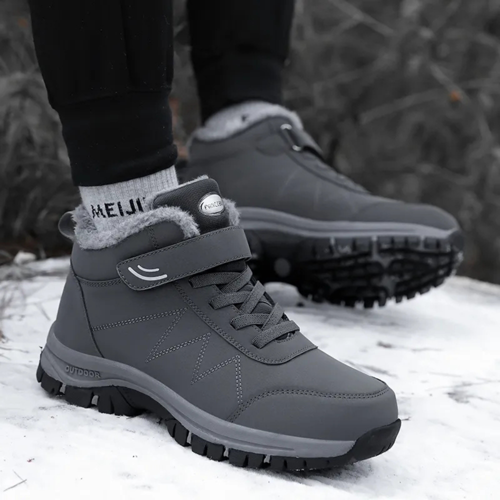 Graue Winterstiefel mit Klettverschluss, rutschfeste Sohle, warm gefüttert, Outdoor geeignet.