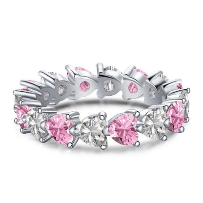 Silberring mit rosa Saphiren, Herzform, Ehering, elegantes Schmuckdesign, Damenmode.
