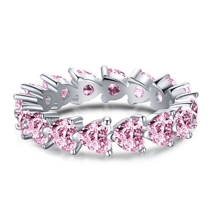 Silberring mit rosa Saphiren, Herzform, Ehering, elegantes Schmuckdesign.