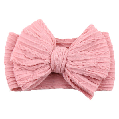 Rosa Baby-Stirnband aus Baumwolle mit Schleife, gestrickt, modisches Accessoire für Mädchen.