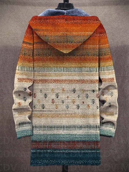 Baksida av långkofta med luva, orange övergång till beige, små trädmotiv och blågrön kant 2