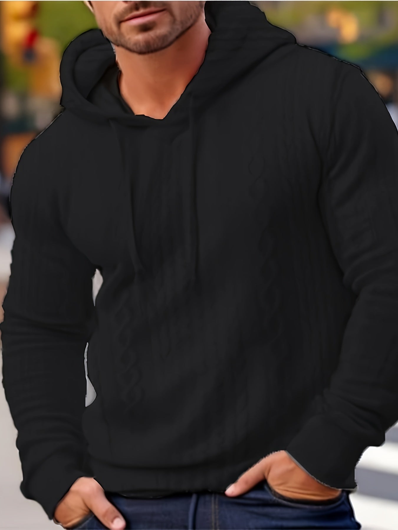 Mann in schwarzem Kapuzenpullover, lässige Mode, Herbstkleidung, Streetwear.