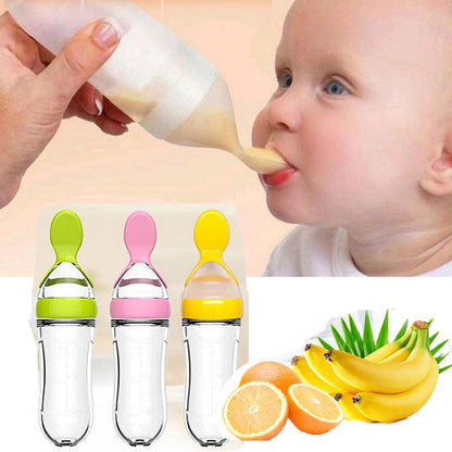 Baby trinkt aus Silikon-Babyflasche mit Löffelaufsatz, Obstpüree, BPA-frei, bunt.