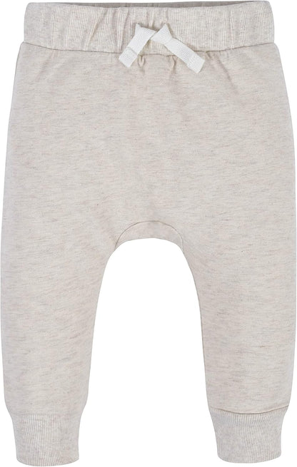 Beige Babyhose aus Baumwolle mit Kordelzug, weiches Material, ideal für Neugeborene.