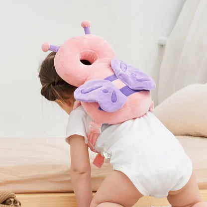 Kleinkind mit rosa Schmetterling-Kopfschutz, Plüsch, Sicherheitskissen, Baby, Schutzhelm.