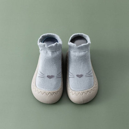 Graue Babyschuhe mit Katzengesicht, rutschfest, weiches Material, ideal für Kleinkinder.