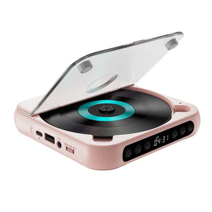 Rosa CD-spelare med öppet lock och turkost skivcentrum, sedd snett framifrån med USB-C, USB-port och knappar synliga. 14