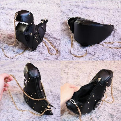 Schwarze Dinosaurier-Handtasche mit goldener Kette, Nieten, Kunstleder, modisches Accessoire.