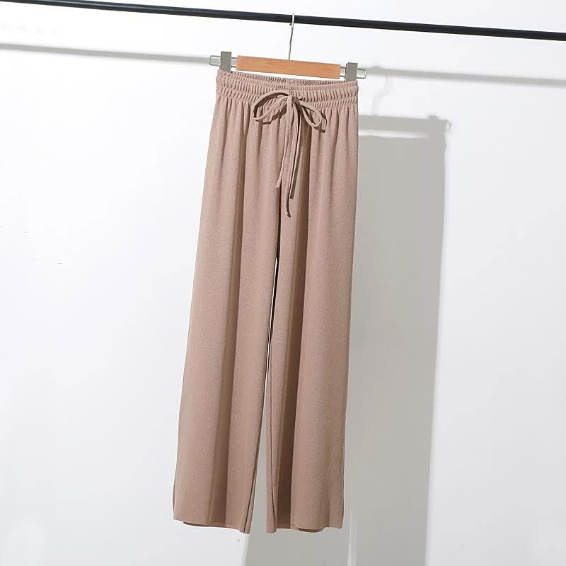 Beige Damenhose aus Baumwolle, locker geschnitten, mit Kordelzug, ideal für Freizeitmode.