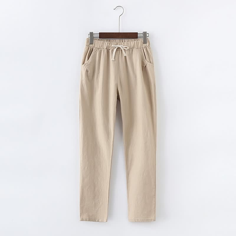 Beige Damenhose aus Baumwolle mit elastischem Bund und Kordelzug, lässiger Stil.