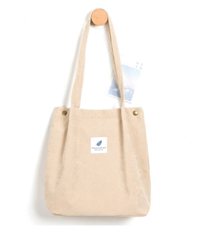 Beige Baumwolltasche mit langen Henkeln, minimalistisches Design, umweltfreundlich, Einkaufstasche.