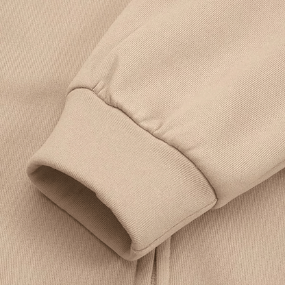 Beiger Baumwollpullover-Ärmel, geripptes Bündchen, weiches Material, modische Freizeitkleidung.