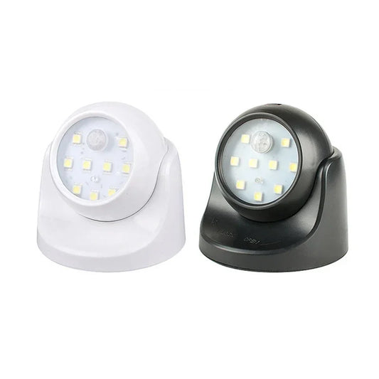 Zwei LED-Nachtlichter, schwarz und weiß, batteriebetrieben, für Innenbeleuchtung.