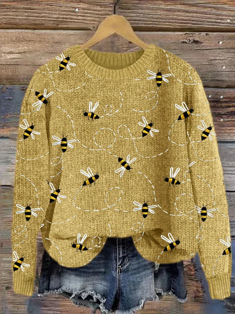 Gelber Strickpullover mit Bienenmuster, Damenmode, lässig, gemütlich, Herbstkleidung.