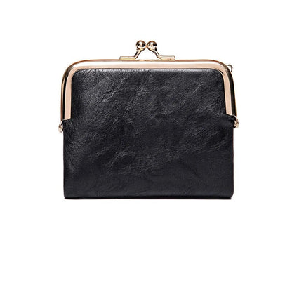 Schwarze Leder-Geldbörse mit Metallverschluss, elegantes Design, Damen-Accessoire.