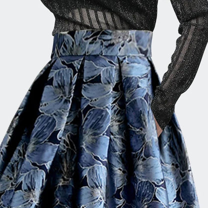 Damenrock blau geblümt, hoher Bund, elegantes Design, ideal für festliche Anlässe.