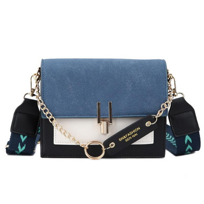 Blaue Damenhandtasche aus Leder mit Kettendetail, modisch, elegant, vielseitig einsetzbar.