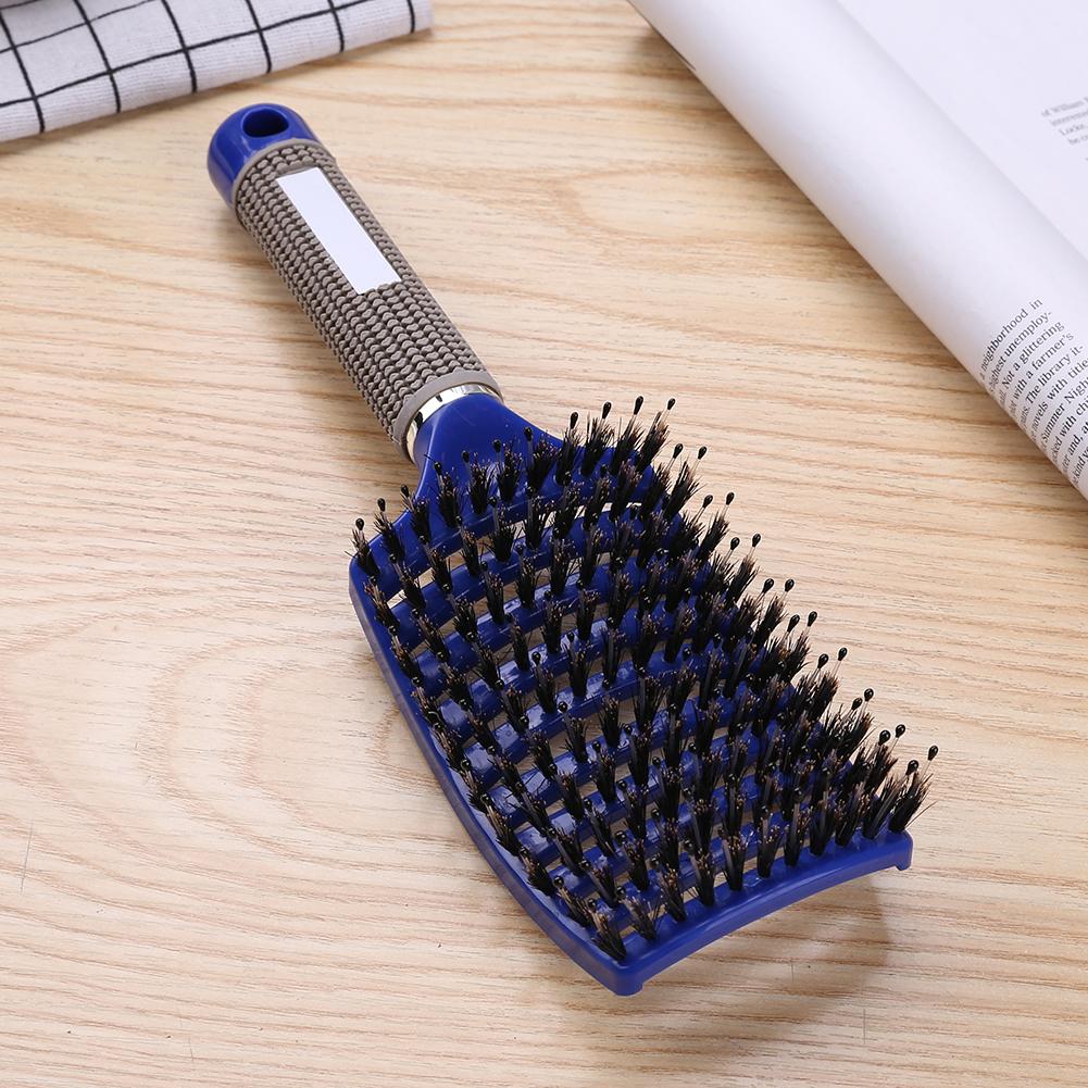 Blaue Haarbürste mit Nylonborsten, ergonomischer Griff, ideal für Styling und Entwirren.