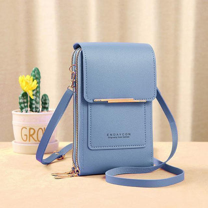 Blaue Leder-Handytasche mit Schulterriemen, modisch, kompakt, ideal für unterwegs.
