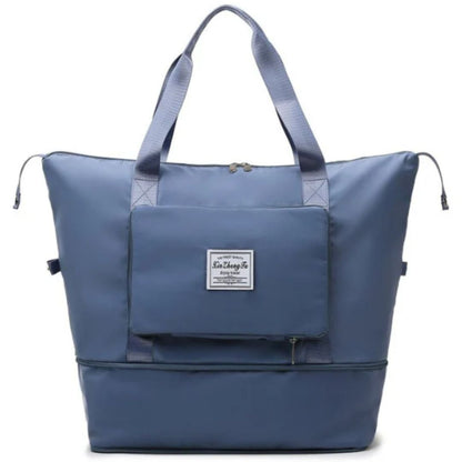 Blaue faltbare Reisetasche, wasserdicht, mit Reißverschluss und Tragegriffen.