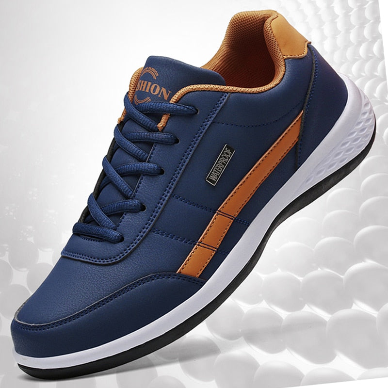 Blauer Sneaker Herren, Leder, orange Akzente, rutschfeste Sohle, modisch, bequem, sportlich.