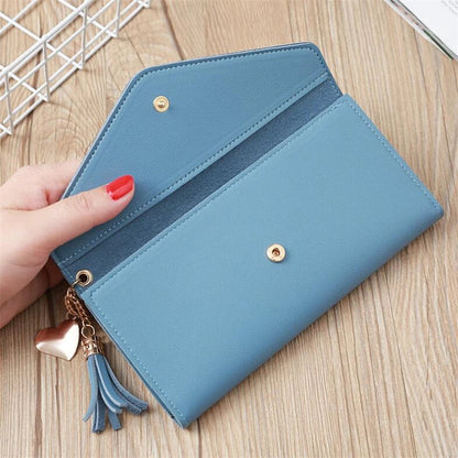 Blaue Damen-Geldbörse aus Leder mit Quastenanhänger, modisches Accessoire, elegant und praktisch.