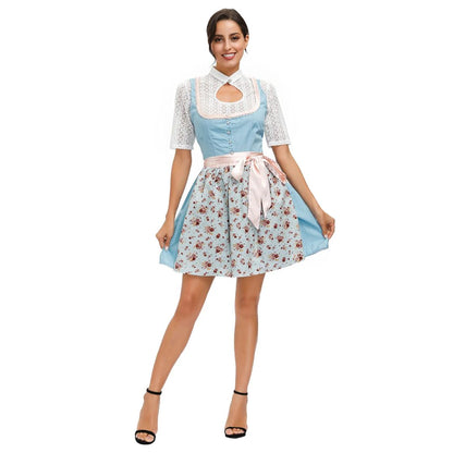 Damen-Dirndl blau-weiß, florales Muster, Spitzenärmel, rosa Schürze, traditionelles Oktoberfest.